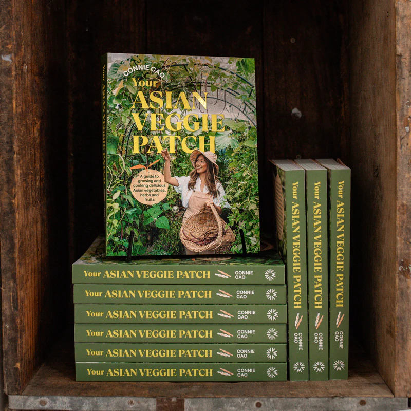 A stack of books titled Your Asian Veggie Patch