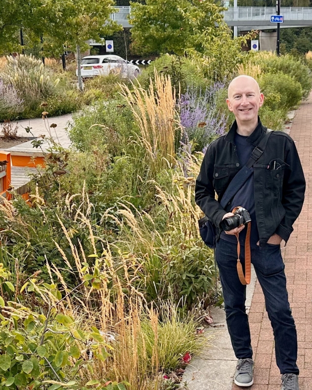 Prof. Nigel Dunnett stands in front of a garden bed