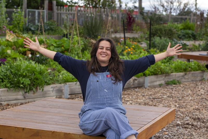 Hannah on a bench in the garden