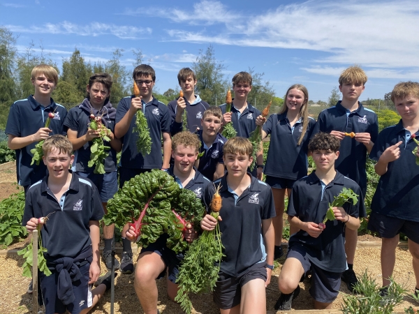Secondary students with their produce